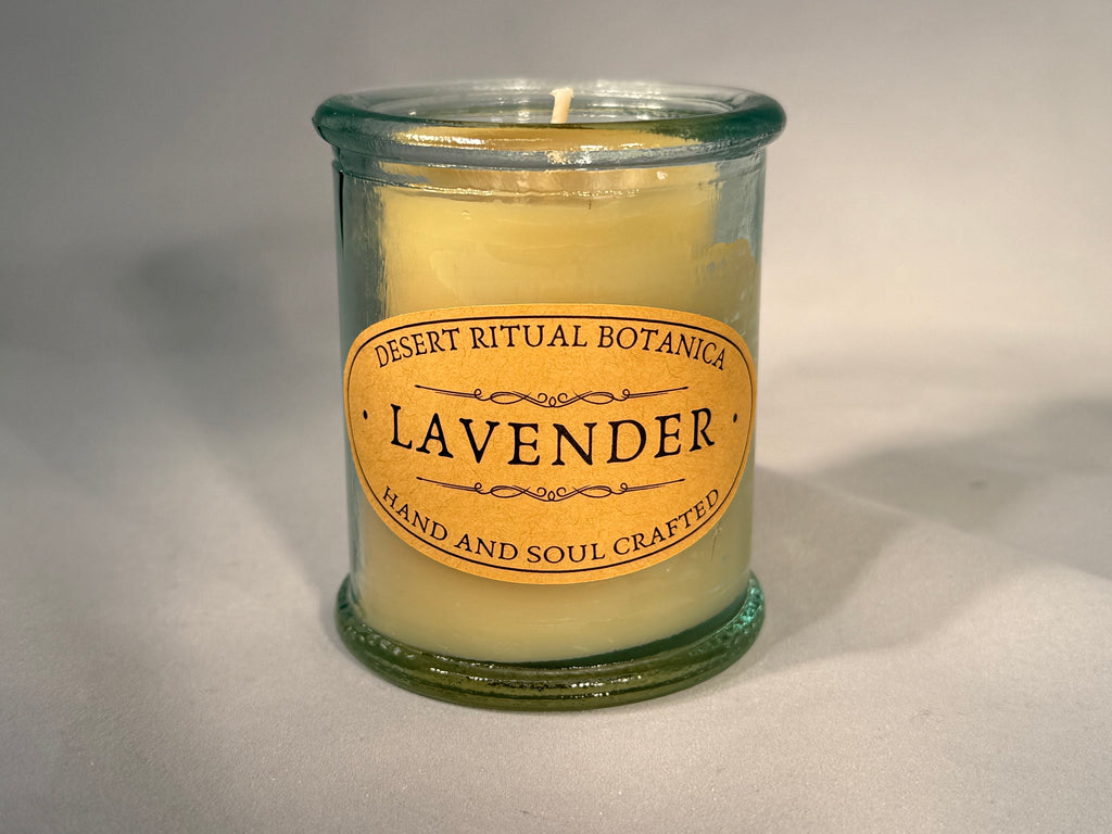 Organic beeswax candle infused with pure lavender essential oil in a reusable glass jar, hand-poured for calming rituals and natural relaxation.